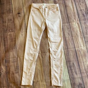 Pale pink skinny jeans